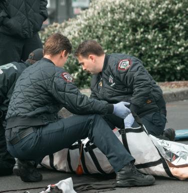 Paramedics treating patient